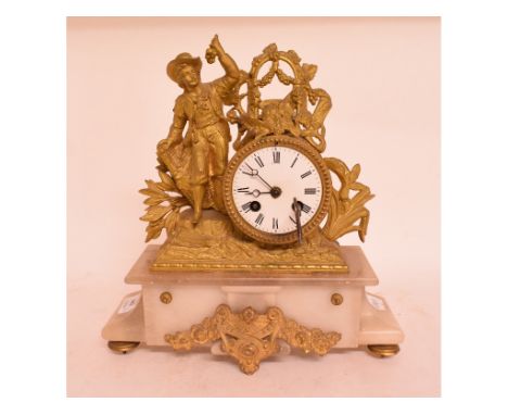 A 19th century French gilt metal and alabaster figural mantel clock striking on a bell, 29 cm wide, an oak cased mantel clock