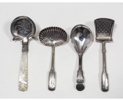 A George IV silver caddy spoon, the shaped bowl engraved with floral ornament and with carved mother of pearl handle, by John