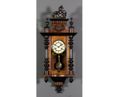 A late 19th Century walnut and ebonised "Vienna Regulator" wall clock, the 5ins diameter cream enamel dial with Roman numeral