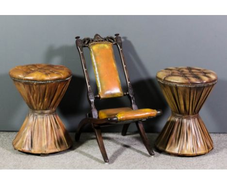 A pair of modern circular drum pattern stools of waisted form, the whole upholstered in tan hide, the top buttoned and studde