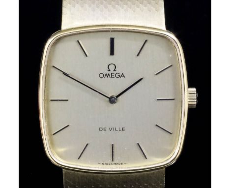 A 1980's gentleman's 14k gold Omega Deville wristwatch, the cushion shaped champagne dial with baton numerals, 29mm overall, 