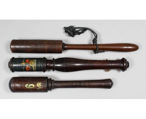 A George III  turned mahogany tipstaff painted with a crown and a royal monogram (indistinct), 12.25ins, a short turned wood 