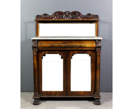 A William IV rosewood chiffonier, the back with shaped cresting carved with scroll and flowerhead ornament, fitted shelf abov