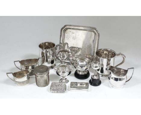 A George V silver square salver, the moulded edge with re-entrant corners, reeded and ribbon mounts, on four bracket feet, 8.