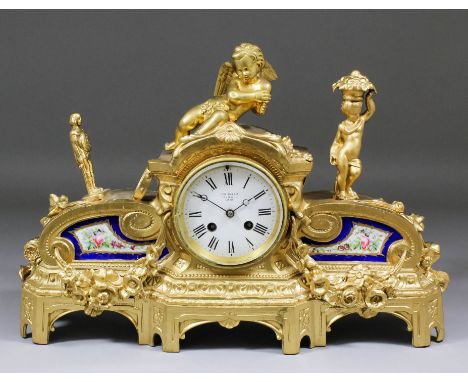 A late 19th Century French gilt metal and porcelain mounted cased mantel clock, the 3.75ins diameter white enamelled dial ret