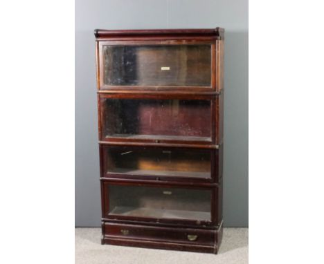 A Globe Wernicke stained wood four tier sectional bookcase, each tier enclosed by a rising glazed panel and fitted drawer to 