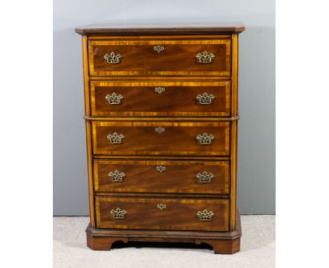 A modern American mahogany chest inlaid with crossbanded and with angled corners, with reeded edge to top, fitted five long g