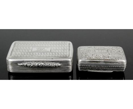 A George IV silver rectangular vinaigrette with cast leaf scroll pattern thumbpiece and engine turned lid and base, the gilt 