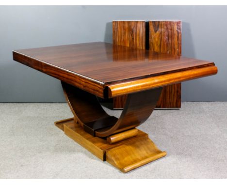 A 1930s Continental rosewood rectangular extending dining table of Art Deco design, with two extra leaves and chrome metal mo