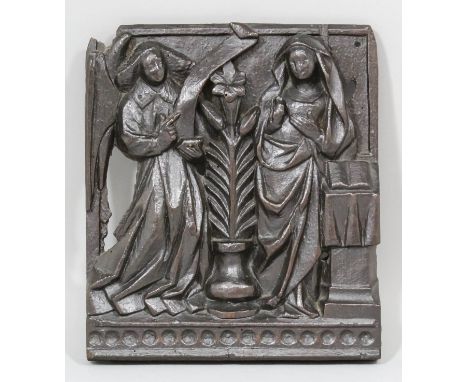 An early 16th Century carved oak panel - The Anunciation - showing the Virgin Mary and Gabriel, 9ins x 7.875ins, German or Lo