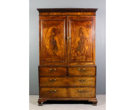 A George III gentleman's mahogany wardrobe, the upper part with moulded and dentil cornice, now fitted with a hanging rail en