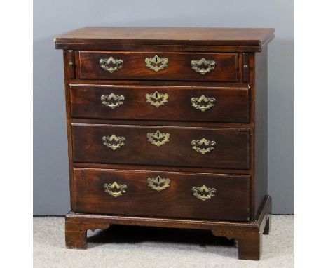 An early George III bachelor's mahogany chest, the solid folding top with rounded edge moulding, fitted four graduated drawer