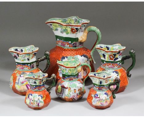 A set of graduated Masons pottery jugs printed and painted with the "Red Scale" pattern, from 4.25ins to 9.5ins high (all wit