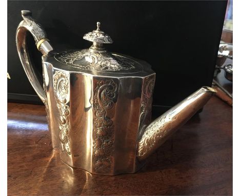 Georgian silver teapot of ovoid form with embossed decoration London assay for 1790? 18.5 ozt good condition with slight bump