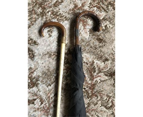 Whalebone walking stick with horn handle with good quality umbrella with silver mount. Whalebone 69.5 cms long with handle 78