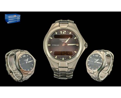 Gentleman's Tissot Titanium Wristwatch, steel bracelet strap, black face, baton markers.  In original box with paperwork.  Fu