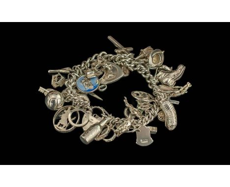 Silver Charm Bracelet. Charms Includes Robot, Football, Cross, Boot, Church, Cat, Bottle, Scissors, Harp, Rings, Cherub etc. 