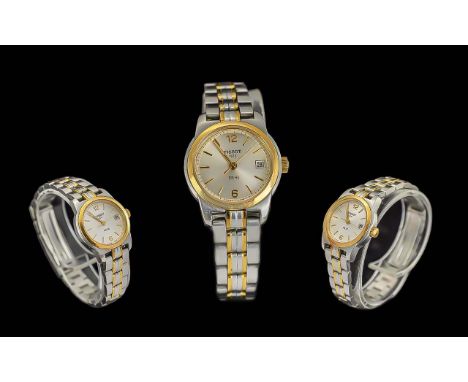 Ladies Tissot Wristwatch, two tone chrome and gold tone strap, white face with gold baton markers, working order.