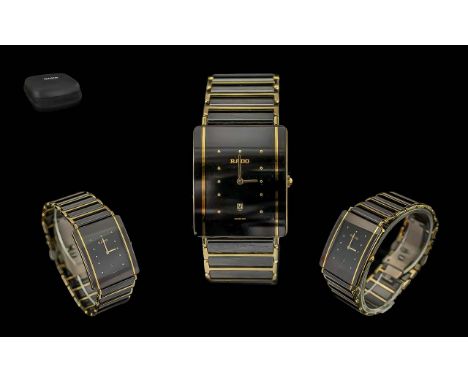 Rado - Stylish Black and Gold Ceramic Quartz Wrist Watch. Features Gold Markers, Just-Date Display Window, Water Resistant, B