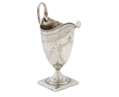 A George III helmet shaped silver cream jug, with reeded rim and handle, engraved with festoons, on square foot, 14cm h, by A