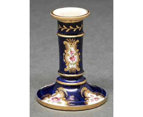 An English porcelain toy candlestick, probably Coalport, c1820, painted with flowers reserved on a gros bleu ground, 58mm h  
