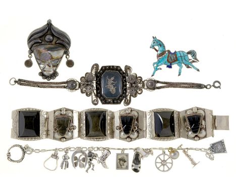 A silver charm bracelet, two others, one niello decorated, a brooch and silver and enamel horse brooch, various sizes (5)  