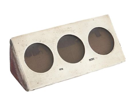 An Edward VII silver triple miniature photograph frame, of triangular section with&nbsp; pierced front and leather covered ba