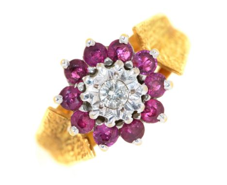 A ruby and diamond cluster ring, &nbsp;in 18ct gold with textured shoulders, &nbsp;Sheffield 1975, 5.6g, size K  