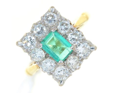 An emerald and diamond ring, the step cut emerald (4.5 x 6mm) in a surround of ten evenly sized and brilliant cut diamonds, i