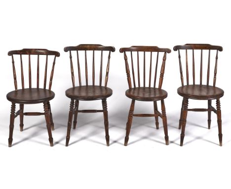 A set of four stained-beech stick back kitchen chairs, with round ash or beech seat, on turned legs, seat height 46cm  Wear c