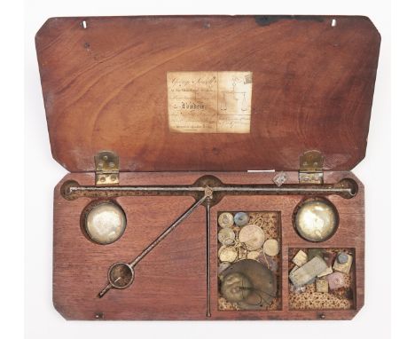 A George III coin scale, George Sewell London w.1768-1777, with steel beam,&nbsp;brass pans and miscellaneous weights, in fit