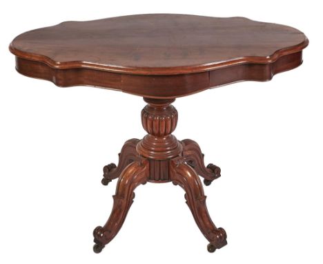 A serpentine mahogany loo table, 19th c, fitted with a drawer, on turned pillar with lobed knop and four scroll feet, horn ca