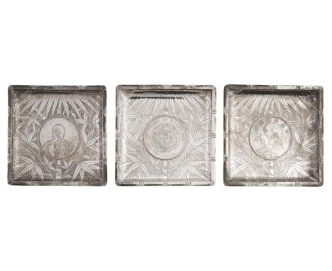 A set of three Chinese silver ashtrays, Republic period, each inset with a trade dollar or similar coin, 85 x 85mm, unmarked,
