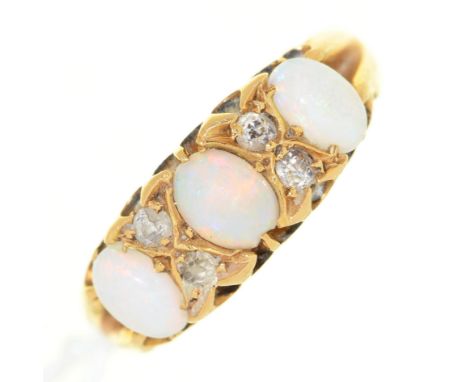 An Edwardian&nbsp; opal and diamond ring, in 18ct gold, Chester 1904, 3.9g, size M½  Central opal chipped, all scratched from