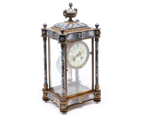 A French gilt brass and champlevé enamel four glass mantel clock with pillars and urn finial, c1890, the primrose enamel dial