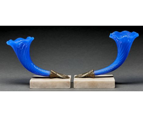 Two blue glass cornucopia vases,&nbsp;the vase issuing from a cast metal lady's hand, on marble slab, 15 and 17cm h  In subst