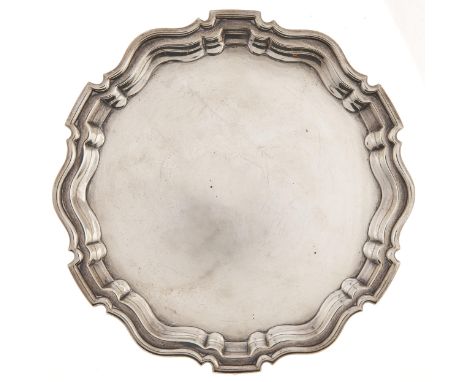A George V silver salver, on three feet, 24.5cm diam, by Robert Pringle &amp; Sons, London 1926, 16ozs 10dwts  A clean exampl
