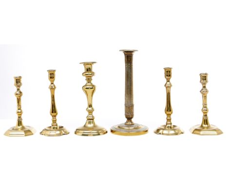 A pair of English brass candlesticks, 18th c, seamed, 22.5cm h, one and a pair of Victorian brass candlesticks and a French E