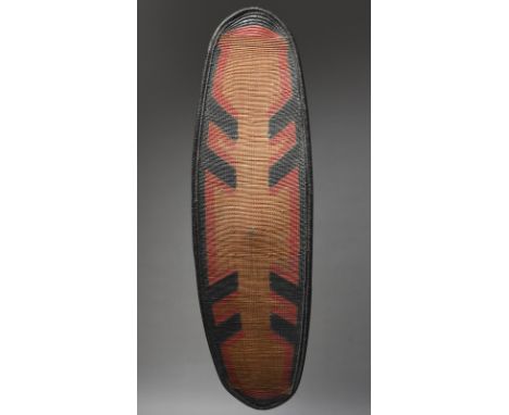 A Zande shield Democratic Republic of the Congo fibre with red and black painted decoration, the back with an applied wood ha