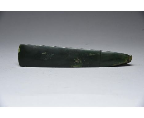 A Maori toki pounamu adze blade New Zealand nephrite, worked for attachment, 24.8cm long.