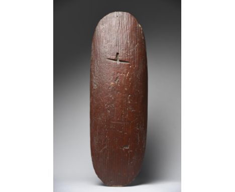 An Aborigine shield Central Desert Region, Northern Territory, Australia with carved grooves to the front and back, with fire