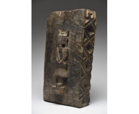 A Nuristan panel fragment with an applied ancestor figure and one side and part of the back with carved geometric designs, 38