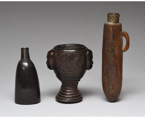 A Zulu /Sotho snuff container South Africa with carved linear decoration and a loop handle and with brass wire to the neck, 1