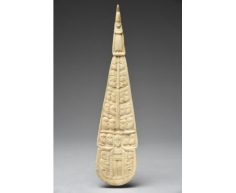 A Yoruba ceremonial ladle Nigeria bone, the Eshu finial, pierced for attachment above rows of heads and a standing figure of 