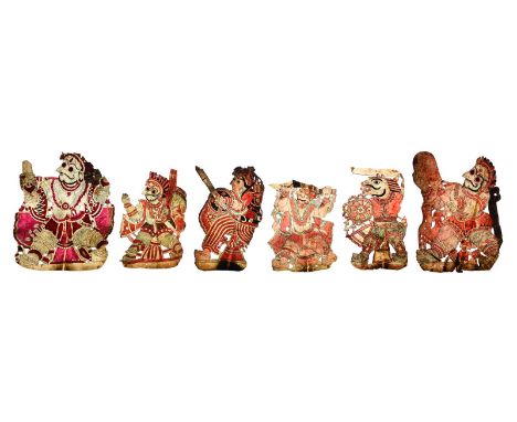 Six Indian puppet characters vellum with cut out and painted decoration, representing differing figures with weapons and or s