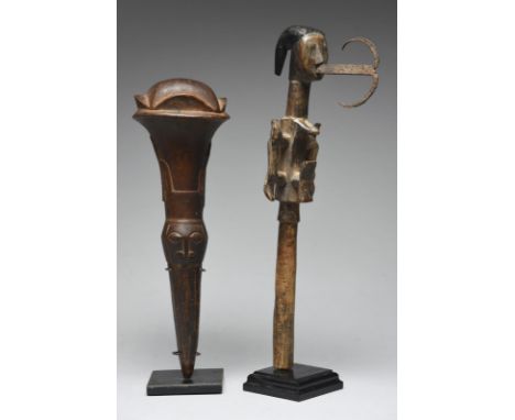 A Baule fly whisk handle Ivory Coast with relief carved birds and masks, 32cm long, and a Fon ceremonial axe, 35.5cm long, on