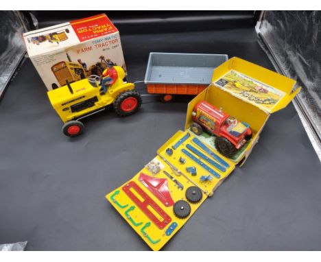 Tinplate:&nbsp;a vintage Japanese Marusan Tractor construction kit in box (1950s); together with a Tomiyama battery operated 