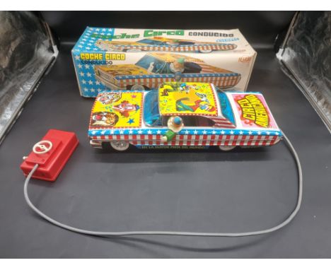 Rico:&nbsp;a vintage tinplate battery operated remote controlled 'Circo Americano' large scale car, in original box.&nbsp; 