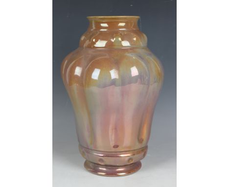A Carter's Poole Pottery lustre vase, dated 1903, designed by Owen Carter, the high-shouldered tapering body with lobed mould