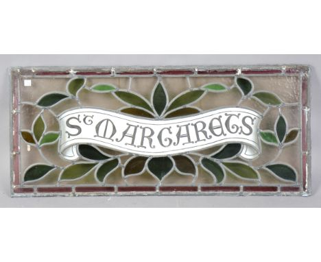 An early 20th century leaded and stained glass panel, the central white glass banner inscribed 'St Margarets', 36cm x 84cm.Bu